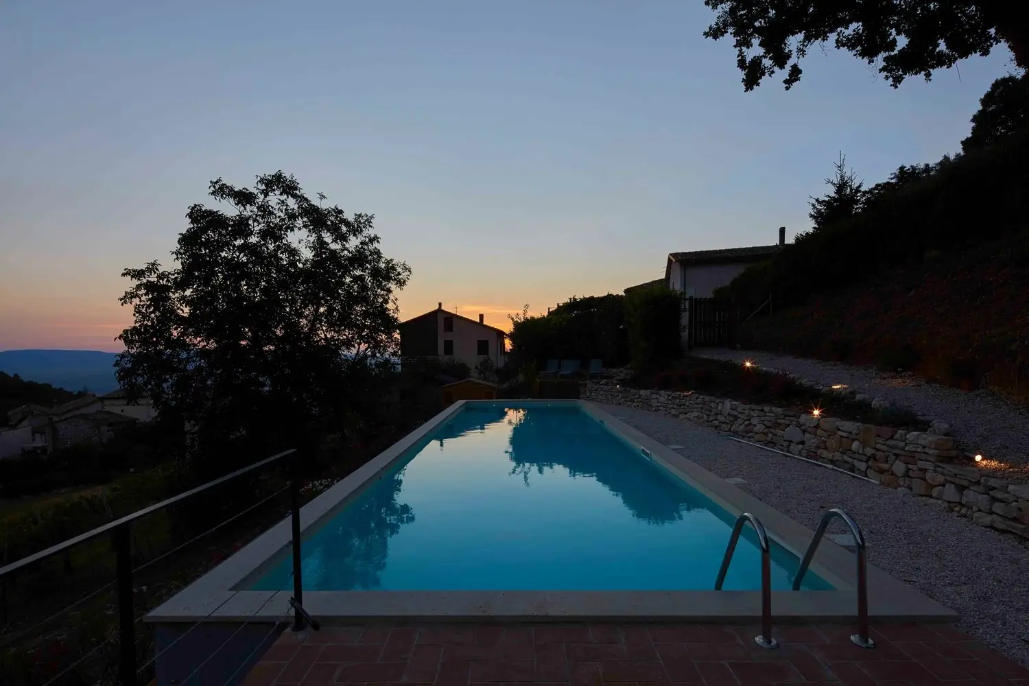 The pool at dusk reflecting the sunset